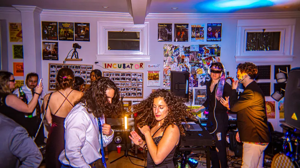 Dance party in the poster-covered living room