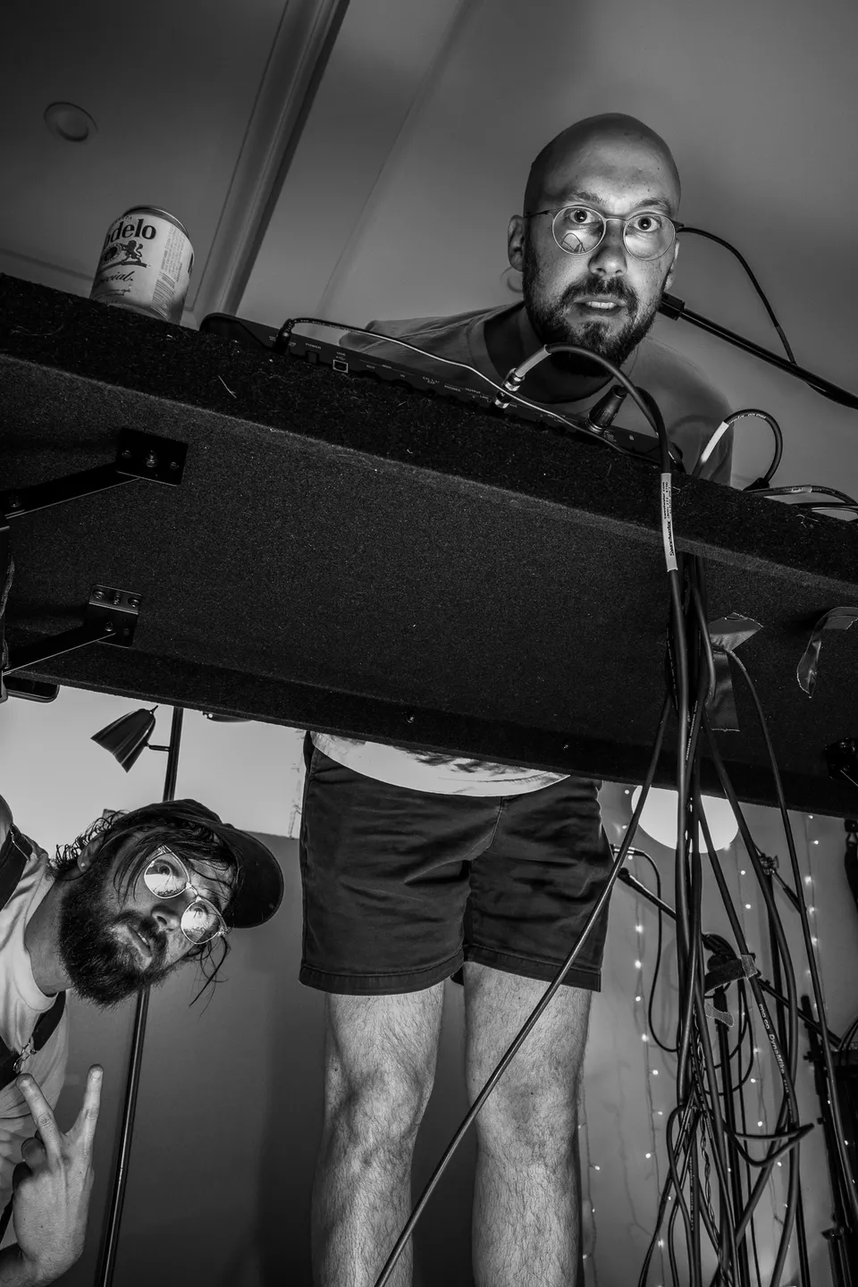 Keyboardist singing, seen from below